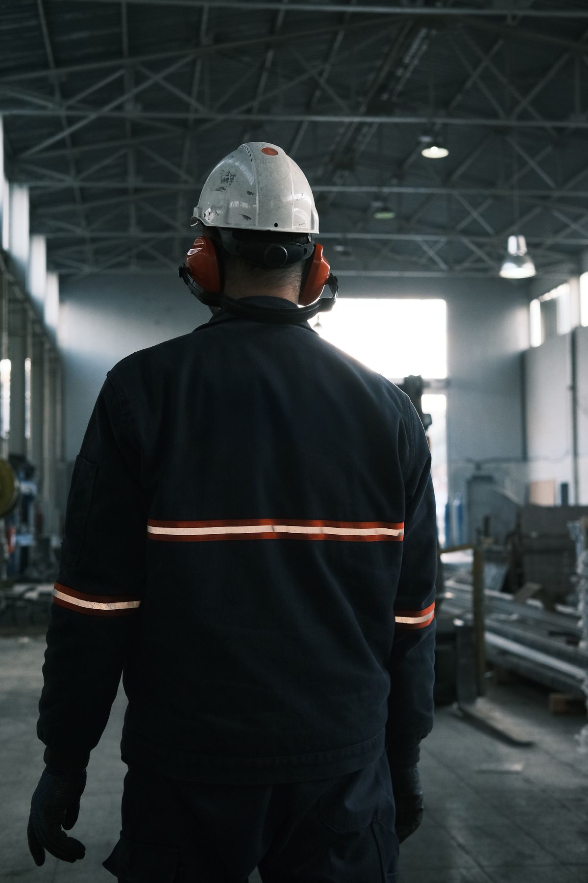 Worker in full protective gear on an industrial site